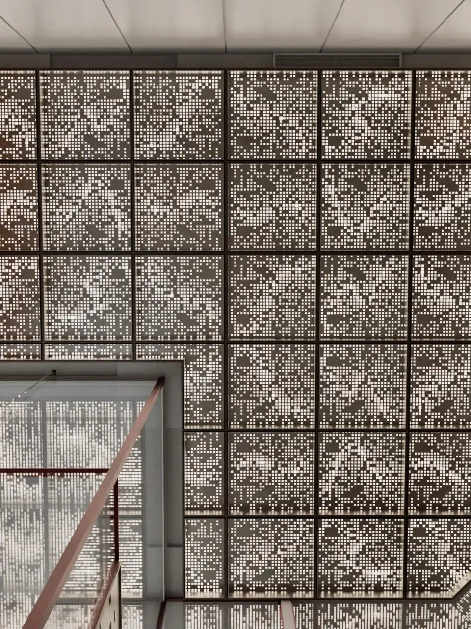 The perforated screen across the building facade