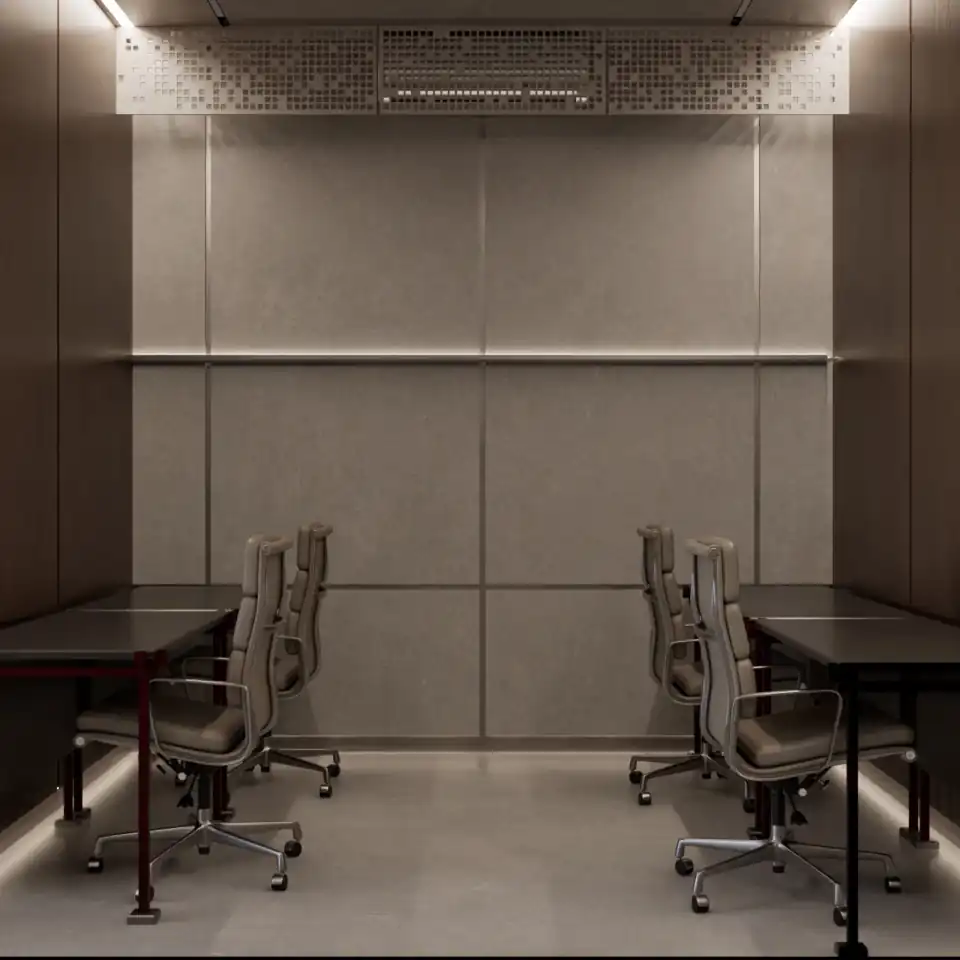 Meeting room with stone wall and paired desks